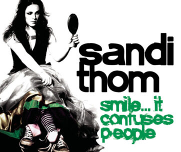 THOM, SANDI - SMILE..IT CONFUSES PEOPLE